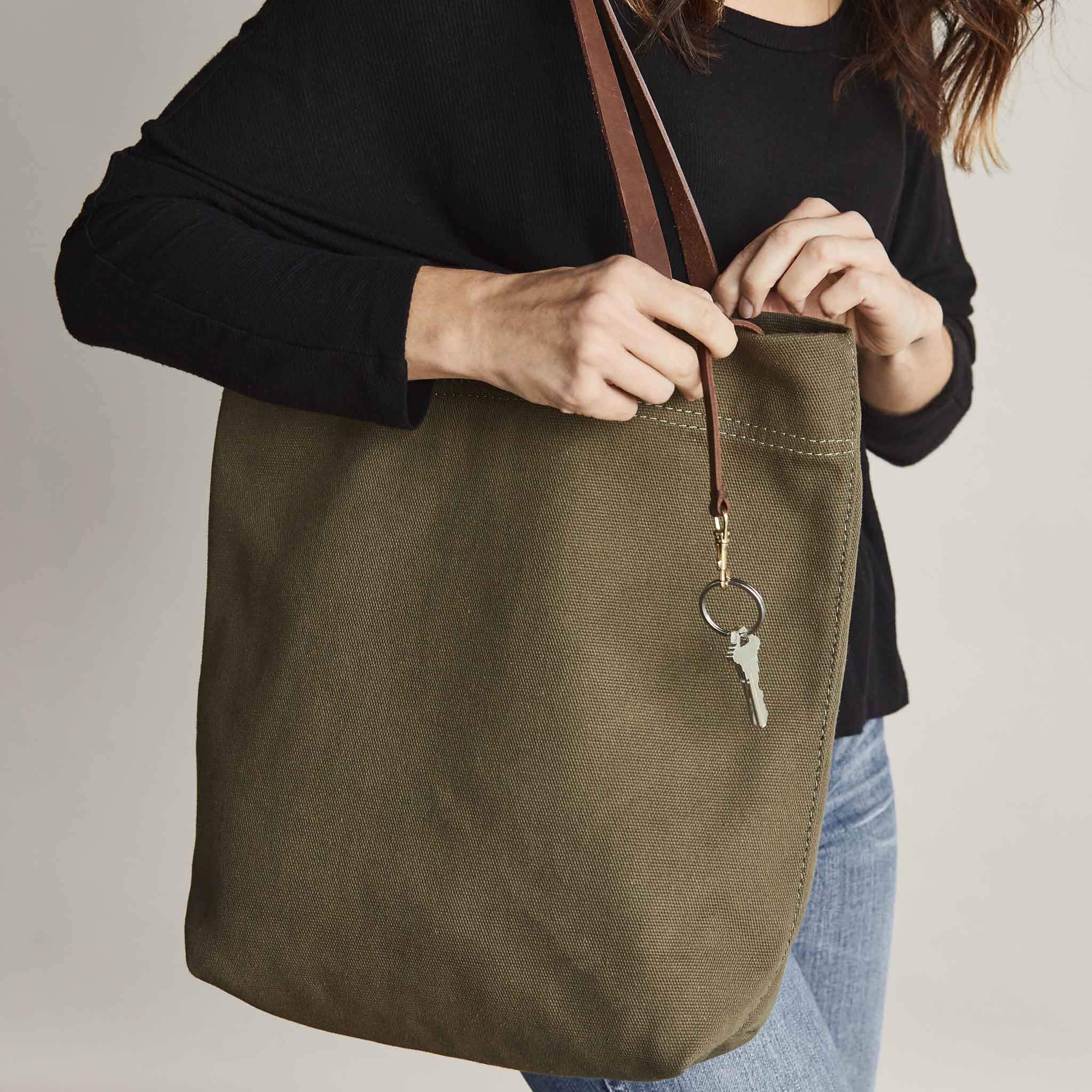 Image 2 of the Canvas Tote Olive Green on model